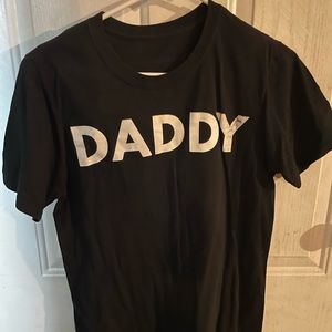 Plain Black t shirt with printed word “daddy” on front